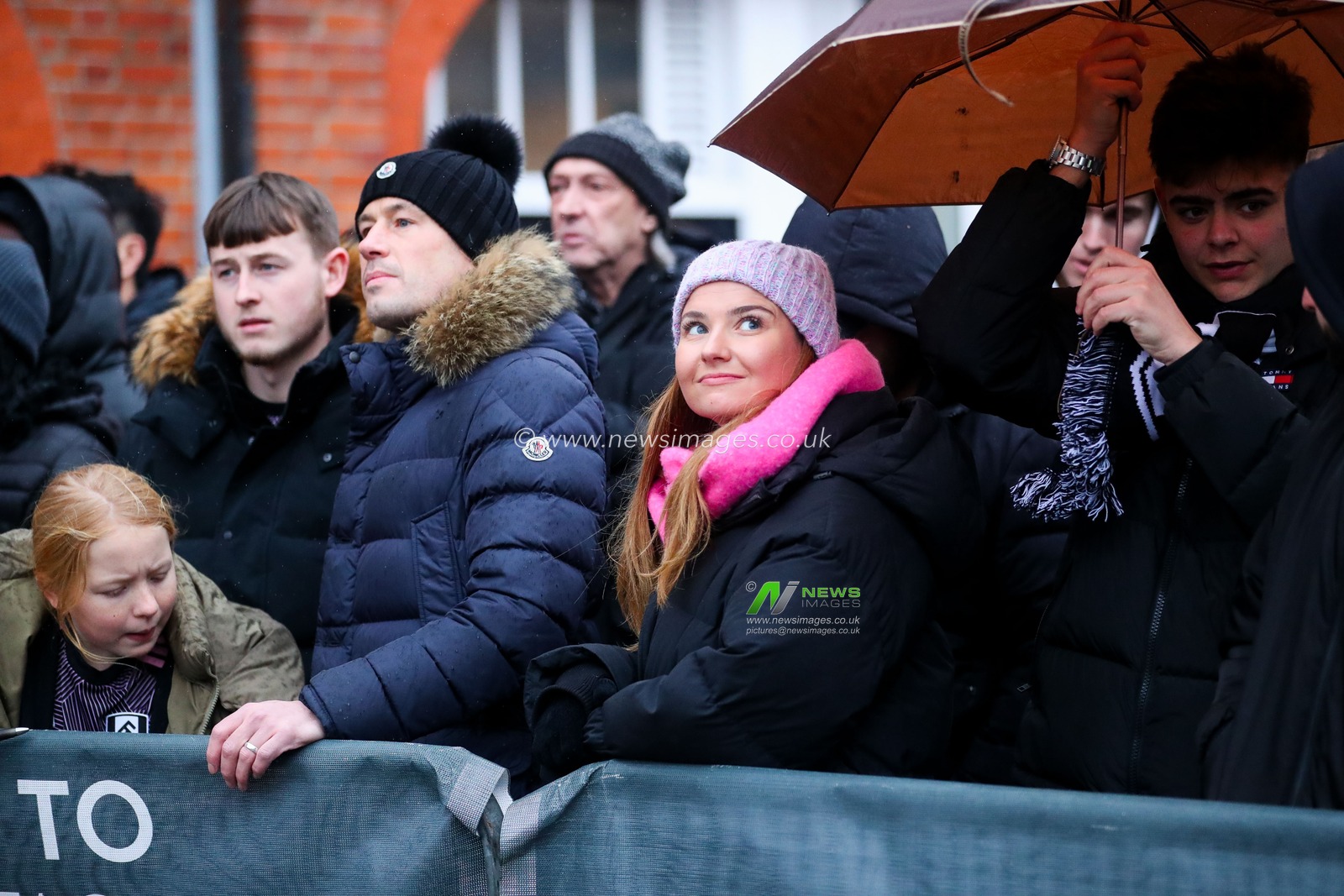 Fans wait in the rain for player arrivals prior to the Premier League match Fulham vs Wolverhampton Wanderers at Craven Cottage, London, United Kingdom, 23rd November 2024

(Photo by Izzy Poles/News Images)
