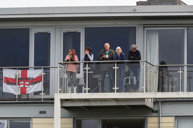 Fans watch on from the balcony of their apartment during the Fifth Metro Bank One Day International match England vs Australia at Seat Unique Stadium, Bristol, United Kingdom, 29th September 2024

(Photo by Gareth Evans/News Images)