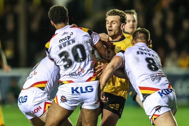 George Lawler of Castleford Tigers is tackled by Andy Ackers of Bradford Bulls and Leon Ruan of Bradford Bulls during the Betfred Super League round 6 match Castleford Tigers vs Bradford Bulls at OneBore Stadium, Castleford, Untied Kingdom on 26 March 2026

(Photo by Alfie Cosgrove/News Images)