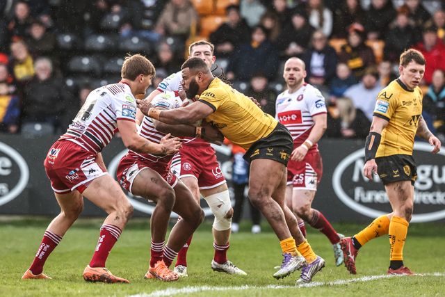 Mikaele Ravalawa of Castleford Tigers is tackled during the Betfred Super League round 1 match Castleford Tigers vs Wigan Warriors at OneBore Stadium, Castleford, Untied Kingdom on 15 February 2026

(Photo by Alfie Cosgrove/News Images)