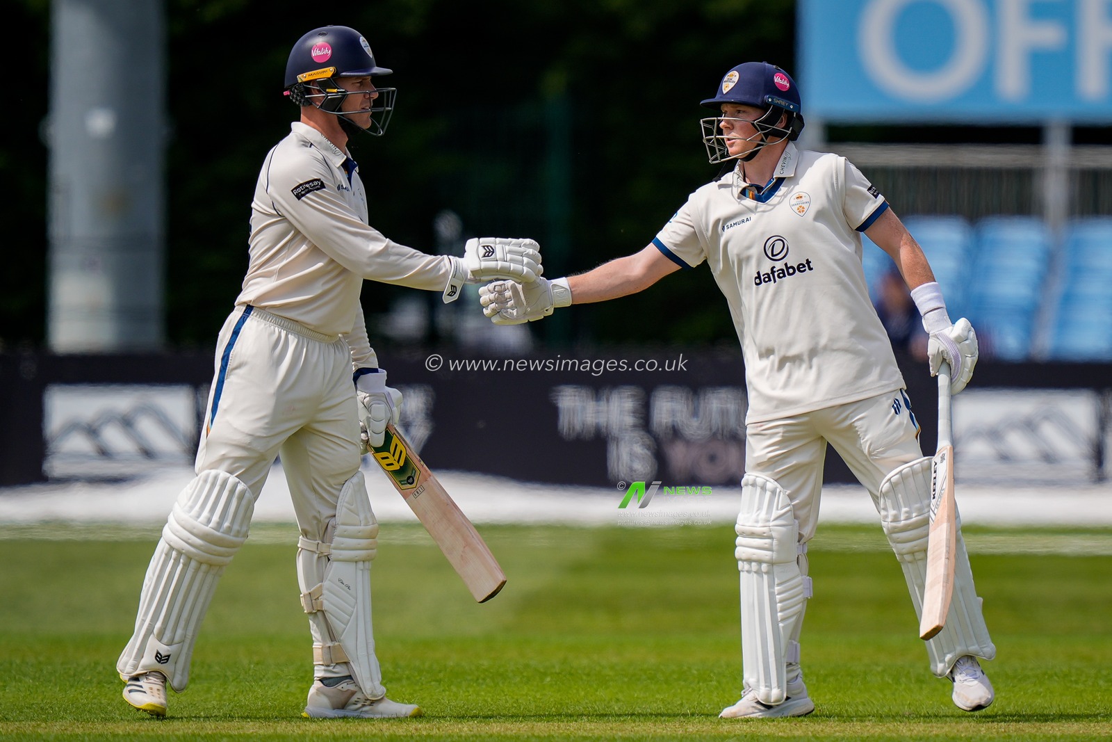 Harry Came of Derbyshire celebrates reaching his 50 by shaking hands with Luise Reece of Derbyshire upon reaching his half century during the County Championship Division Two Derbyshire vs Northamptonshire day one match at The Central Co-Op County Ground, Derby, United Kingdom on 08 May 2026

(Photo by Maynard Manyowa/News Images)