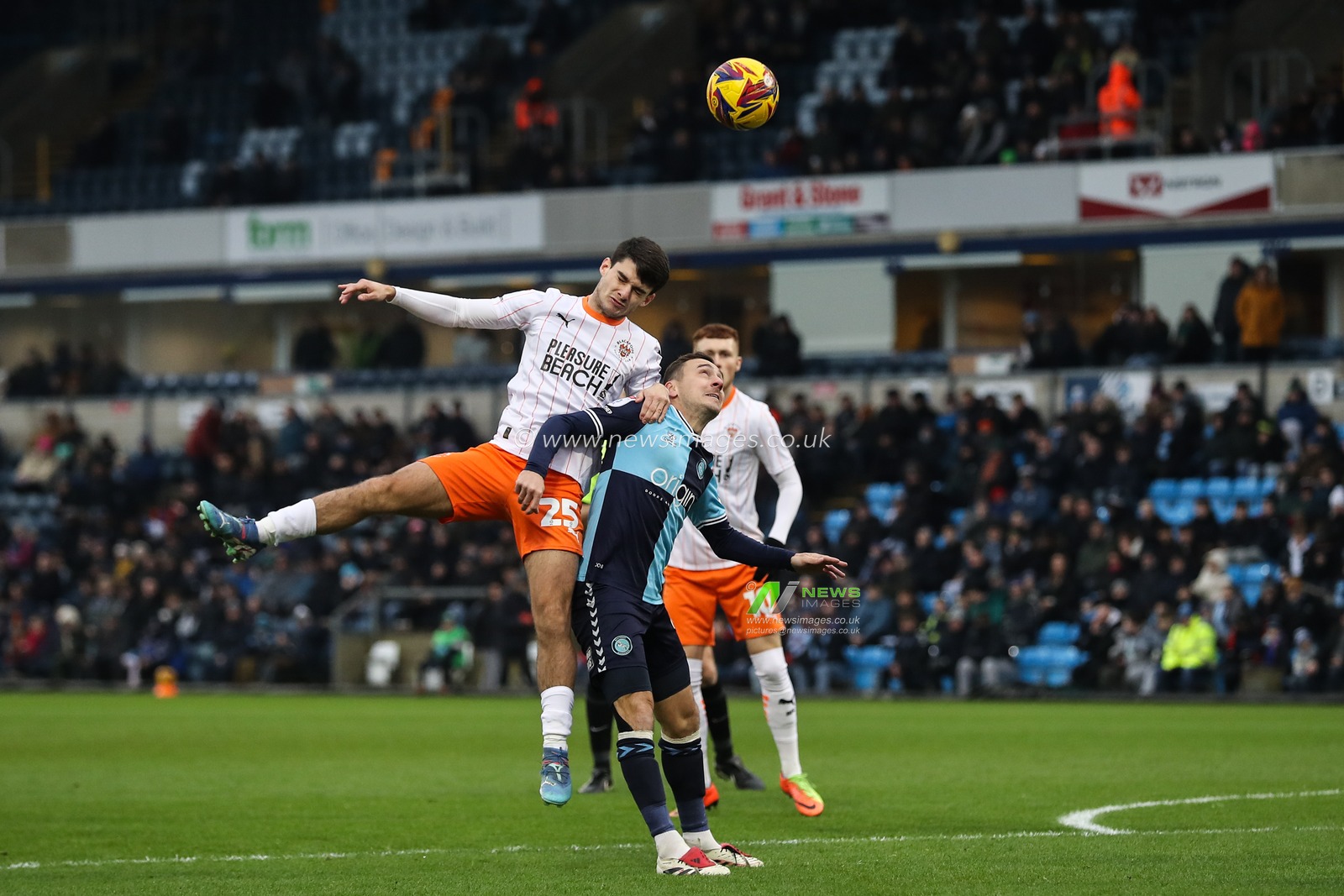 Rob Apter of Blackpool and Josh Scowen of Wycombe Wanderers battle for the ball during the Sky Bet League 1 match Wycombe Wanderers vs Blackpool at Adams Park, High Wycombe, United Kingdom, 4th January 2025

(Photo by Gareth Evans/News Images)