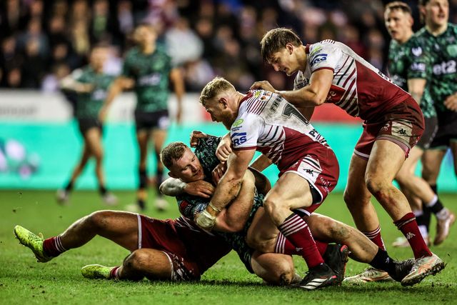 Jack Hughes of Leigh Leopards is tackled by Luke Thompson of Wigan Warriors during the Betfred Super League match Wigan Warriors vs Leigh Leopards at The Brick Community Stadium, Wigan, United Kingdom on 26 February 2026

(Photo by Alfie Cosgrove/News Images)