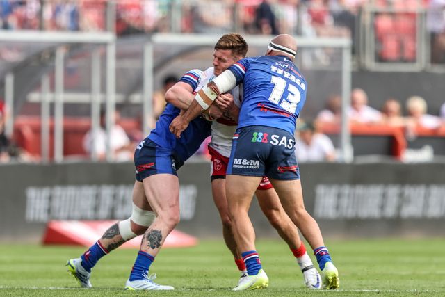 Tom Davies of Hull KR is tackled by Ky Rodwell of Wakefield Trinity and Jazz Tevaga of Wakefield Trinity during the Betfred Super League round 18 match Hull KR vs Wakefield Trinity at Sewell Group Craven Park, Hull, United Kingdom on 11 July 2026

(Photo by Alfie Cosgrove/News Images)