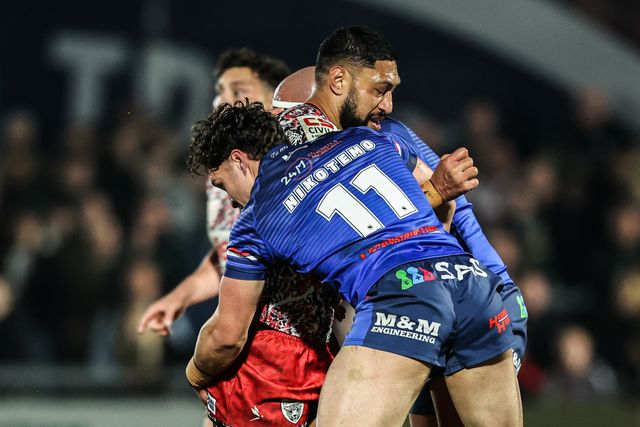 Isaac Liu of Leigh Leopards is tackled by Seth Nikotemo of Wakefield Trinity during the Betfred Super League round 5 match Wakefield Trinity vs Leigh Leopards at DIY Kitchens Stadium, Wakefield, United Kingdom on 20 March 2026

(Photo by Alfie Cosgrove/News Images)