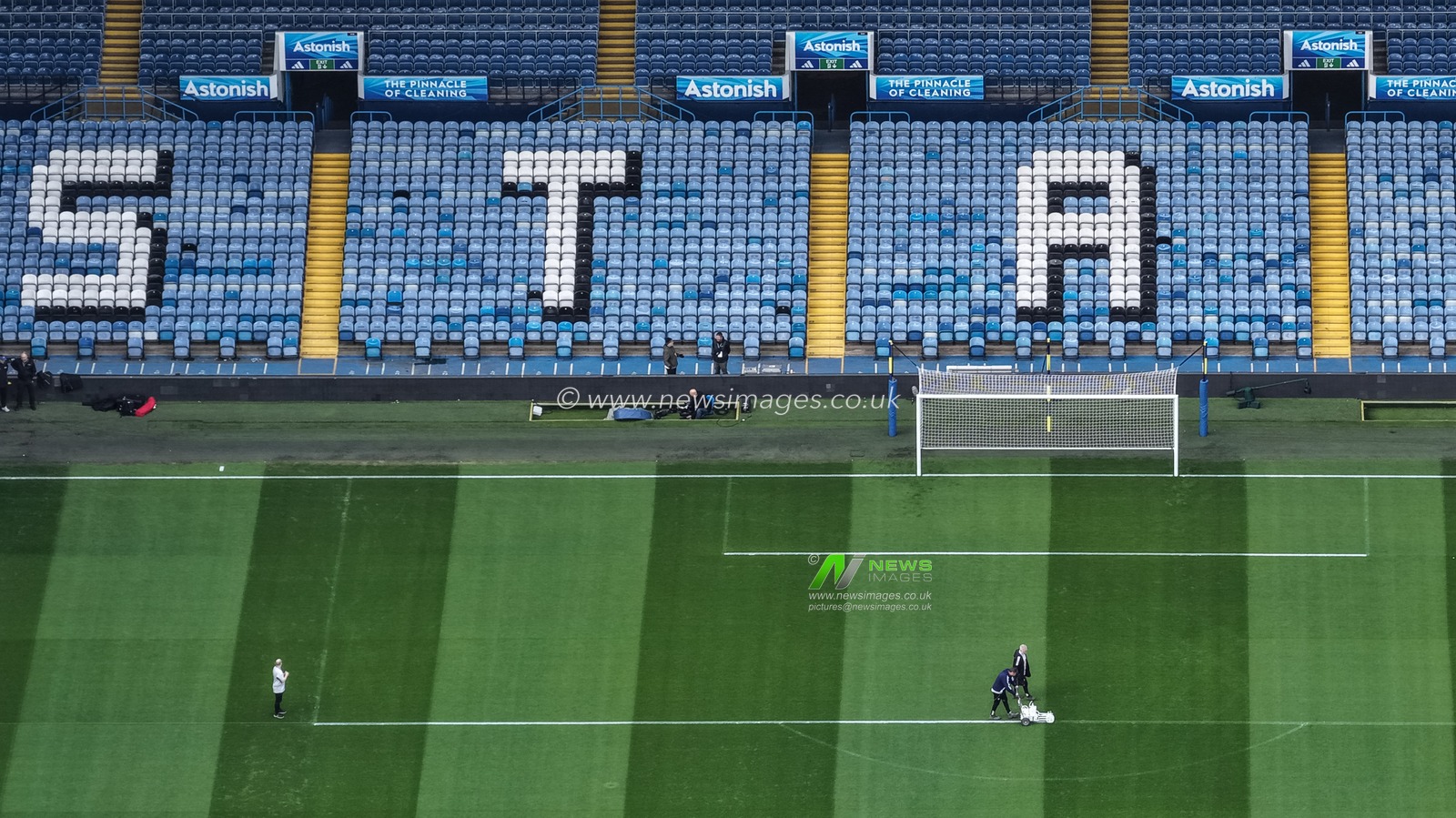 Ground staff mark the white lines around the penalty box during the Premier League match Leeds United vs Manchester City at Elland Road, Leeds, United Kingdom on 28 February 2026

(Photo by Mark Cosgrove/News Images)
