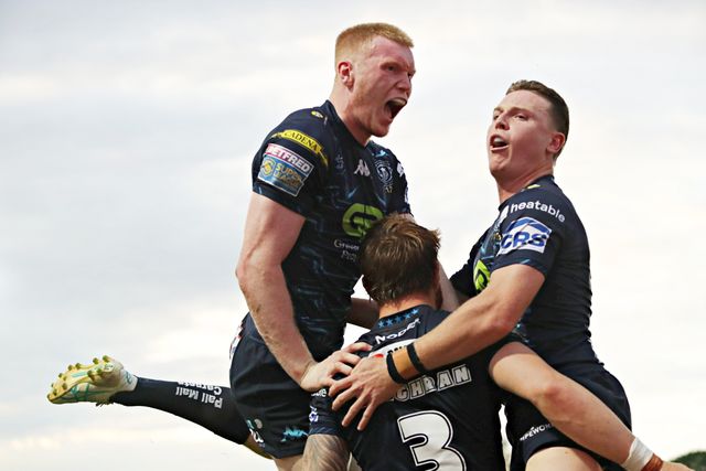 Adam Keighran of Wigan Warriors celebrates his try with Zach Eckersley of Wigan Warriors and Jai Field of Wigan Warriors during the Betfred Super League round 15 match Wakefield Trinity vs Wigan Warriors at DIY Kitchens Stadium, Wakefield, United Kingdom, 20th June 2025(Photo by Sam Eaden/News Images)