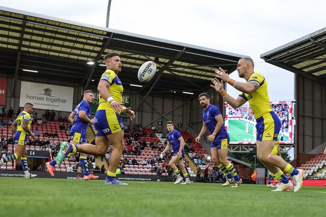 Matt Dufty of Warrington Wolves and Joe Philbin of Warrington Wolves in the pre-game warm up during the Betfred Super League Round 20 Leigh Leopards vs Warrington Wolves at Leigh Sports Village, Leigh, United Kingdom, 1st August 2025

(Photo by Mark Cosgrove/News Images)
