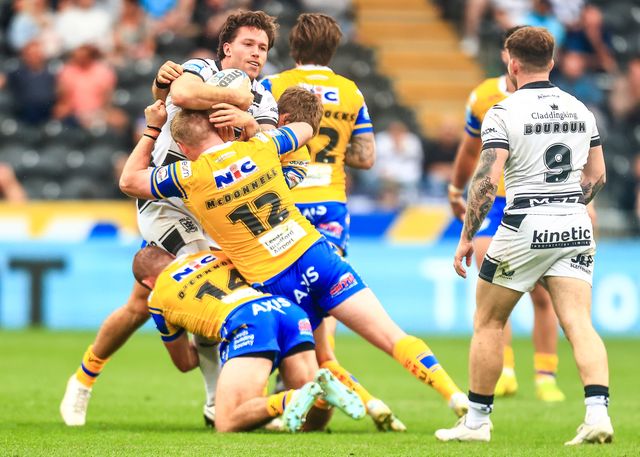 Yusuf Aydin of Hull FC is tackled James McDonnell of Leeds Rhinos  during the Betfred Super League Round 24 match Hull FC vs Leeds Rhinos at MKM Stadium, Hull, United Kingdom, 30th August 2025

(Photo by Richard Bierton/News Images)