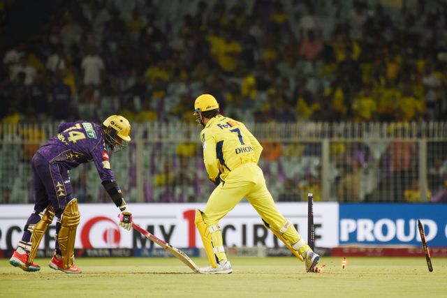 Chennai Super Kings' captain Mahendra Singh Dhoni, right, breaks the stumps to dismiss Kolkata Knight Riders' Sunil Narine, left,during the 2025 IPL match between Kolkata Knight Riders and Chennai Super Kings at Eden Gardens on May 07, 2025, in Kolkata, India. Photo by Debajyoti Chakraborty.(Photo: Debajyoti Chakraborty/News Images)