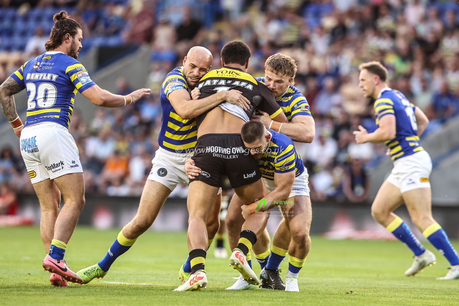 Toa Mata'afa of York Knights is tackled by James Harrison of Warrington Wolves, Luke Thomas of Warrington Wolves and Danny Walker of Warrington Wolves during the Betfred Super League round 23 match Warrington Wolves vs York Knights at The Halliwell Jones Stadium, Warrington, United Kingdom on 13 August 2026

(Photo by Alfie Cosgrove/News Images)