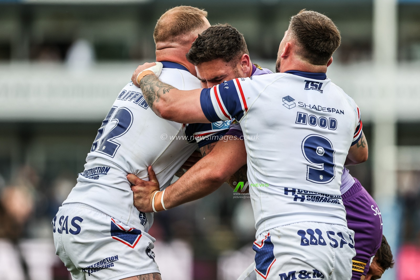 Joe Philbin of Warrington Wolves is tackled by Josh Griffin of Wakefield Trinity and Liam Hood of Wakefield Trinity during the Betfred Super League Round 11 match Wakefield Trinity vs Warrington Wolves at DIY Kitchens Stadium, Wakefield, United Kingdom, 18th May 2025

(Photo by Alfie Cosgrove/News Images)