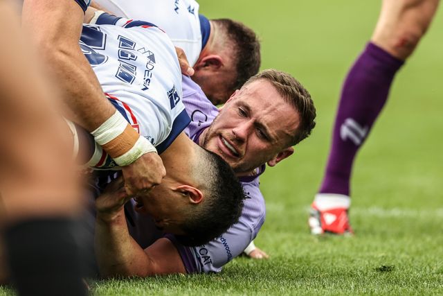 Ben Currie of Warrington Wolves is tackled during the Betfred Super League Round 11 match Wakefield Trinity vs Warrington Wolves at DIY Kitchens Stadium, Wakefield, United Kingdom, 18th May 2025

(Photo by Alfie Cosgrove/News Images)