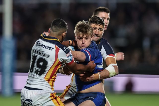 Jayden Myers of Wakefield Trinity is tackled by Tommy Makinson of Catalans Dragons and Kruise Leeming of Catalans Dragons during the Betfred Super League round 11 match Wakefield Trinity vs Catalans Dragons at DIY Kitchens Stadium, Wakefield, United Kingdom on 15 May 2026

(Photo by Mark Cosgrove/News Images)