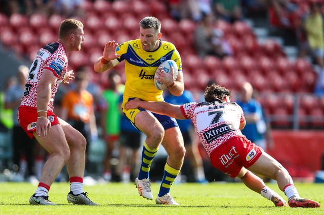 Lachlan Fitzgibbon of Warrington Wolves is tackled by Lachlan Lam of Leigh Leopards during the Betfred Challenge Cup Semi-final match Warrington Wolves vs Leigh Leopards at Totally Wicked Stadium, St Helens, United Kingdom, 11th May 2025

(Photo by Gareth Evans/News Images)