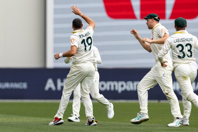 Scott Boland of Australia is congratulated by his team mates after taking a wicket during the NRMA Insurance Ashes First Test Day 2 Australia vs England at Optus Stadium, Perth, Australia, 22nd November 2025

(Photo by Santanu Banik/News Images)

*** GER AUT SUI OUT ***