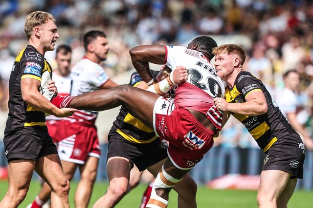 Sam Eseh of Wigan Warriors is tackled by Tom Inman of York Knights and Jack Martin of York Knights during the Betfred Super League round 15 match York Knights vs Wigan Warriors at LNER Community Stadium, York, United Kingdom on 20 June 2026

(Photo by Alfie Cosgrove/News Images)