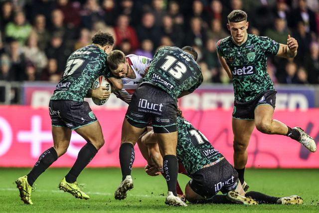 Kaide Ellis of Wigan Warriors is tackled by Liam Horne of Leigh Leopards and Isaac Liu of Leigh Leopards during the Betfred Super League match Wigan Warriors vs Leigh Leopards at The Brick Community Stadium, Wigan, United Kingdom on 26 February 2026

(Photo by Alfie Cosgrove/News Images)