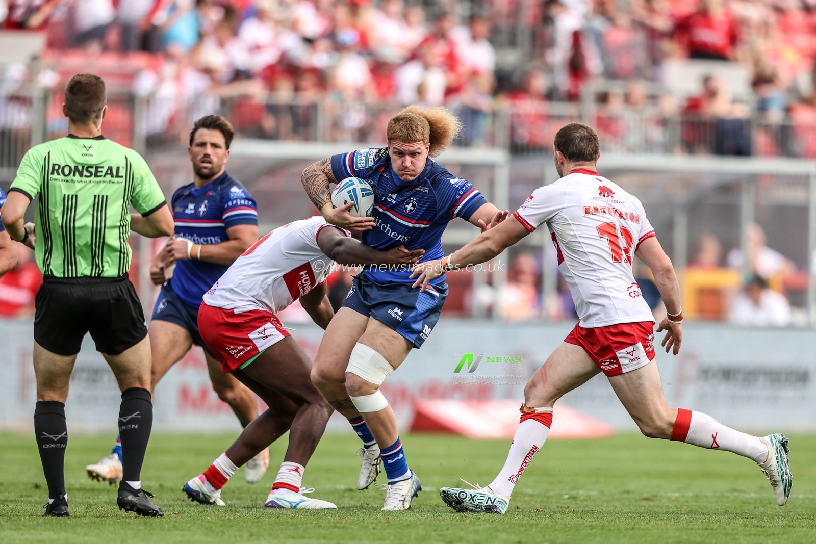 Caius Faatili of Wakefield Trinity is tackled by Jordan Dezaria of Hull KR during the Betfred Super League round 18 match Hull KR vs Wakefield Trinity at Sewell Group Craven Park, Hull, United Kingdom on 11 July 2026

(Photo by Alfie Cosgrove/News Images)
