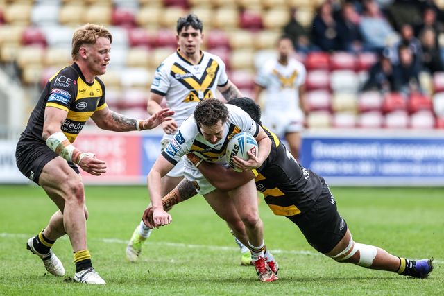 Tom Weaver of Castleford Tigers is tackled by Jack Martin of York Knights and Xavier Va'a of York Knights during the Betfred Super League round 12 match York Knights vs Castleford Tigers at LNER Community Stadium, York, United Kingdom on 16 May 2026

(Photo by Alfie Cosgrove/News Images)
