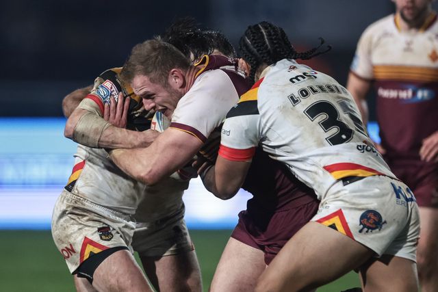 Tom Burgess of Huddersfield Giants is tackled by Joe Mellor of Bradford Bulls and Tray Lolesi of Bradford Bulls during the Betfred Super League Round 5 match Bradford Bulls vs Huddersfield Giants at Odsal Stadium, Bradford, United Kingdom on 20 March 2026

(Photo by Mark Cosgrove/News Images)