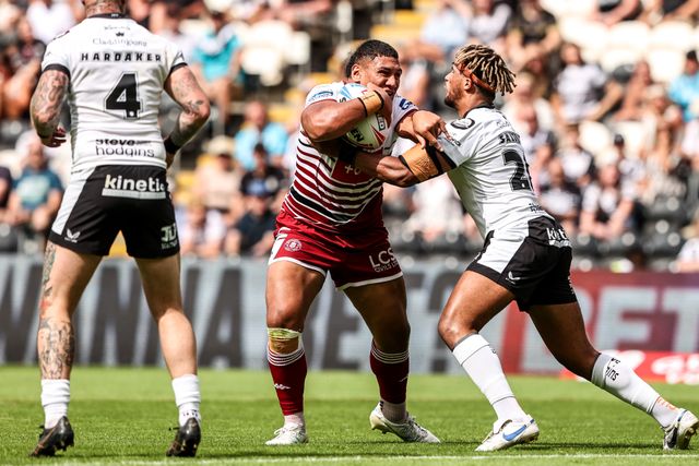 Patrick Mago of Wigan Warriors is tackled by Hugo Salabio of Hull FC during the Betfred Super League round 16 match Hull FC vs Wigan Warriors at MKM Stadium, Hull, United Kingdom on 27 June 2026

(Photo by Alfie Cosgrove/News Images)