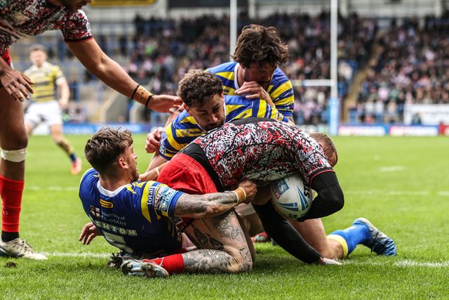 Josh Charnley of Leigh Leopards is tackled by Matty Ashton of Warrington Wolves and Toby King of Warrington Wolves during the Betfred Super League round 7 match Warrington Wolves vs Leigh Leopards at The Halliwell Jones Stadium, Warrington, United Kingdom on 04 April 2026

(Photo by Alfie Cosgrove/News Images)