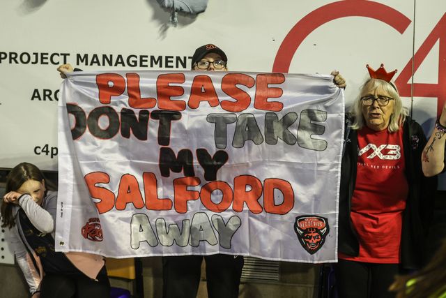 Salford fans protest against their clubs owners during the Betfred Super League Round 24 match Warrington Wolves vs Salford Red Devils at Halliwell Jones Stadium, Warrington, United Kingdom, 29th August 2025

(Photo by Alfie Cosgrove/News Images)
