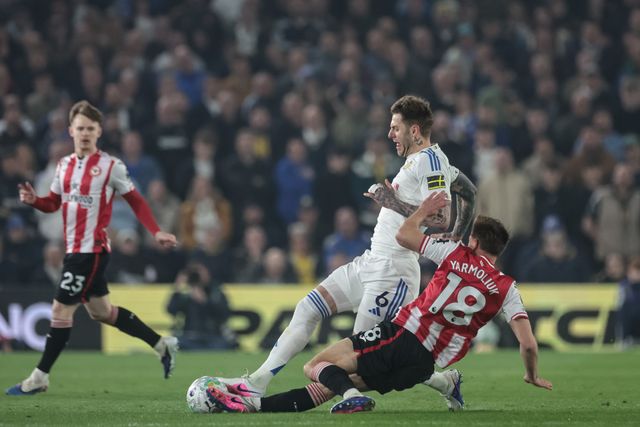 Yehor Yarmolyuk of Brentford slide tackles Joe Rodon of Leeds United  during the Premier League match Leeds United vs Brentford at Elland Road, Leeds, United Kingdom on 21 March 2026

(Photo by Mark Cosgrove/News Images)