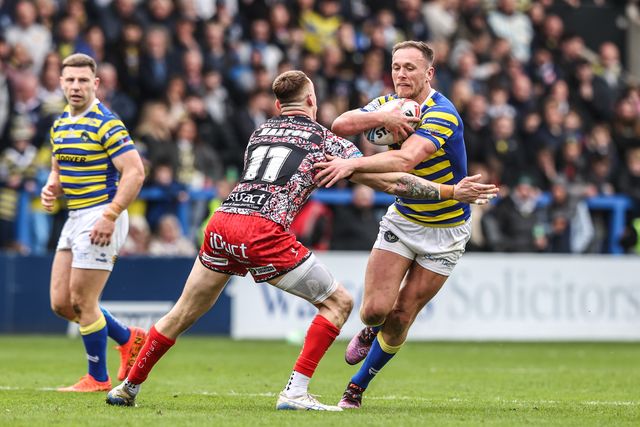 Ben Currie of Warrington Wolves is tackled by Frankie Halton of Leigh Leopards during the Betfred Super League round 7 match Warrington Wolves vs Leigh Leopards at The Halliwell Jones Stadium, Warrington, United Kingdom on 04 April 2026

(Photo by Alfie Cosgrove/News Images)