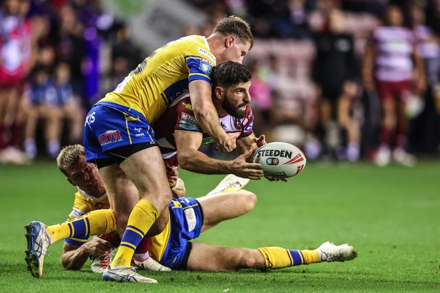 Abbas Miski of Wigan Warriors is tackled by Morgan Gannon of Leeds Rhinos during the Betfred Super League round 27 match Wigan Warriors vs Leeds Rhinos at The Brick Community Stadium, Wigan, United Kingdom, 19th September 2025

(Photo by Alfie Cosgrove/News Images)