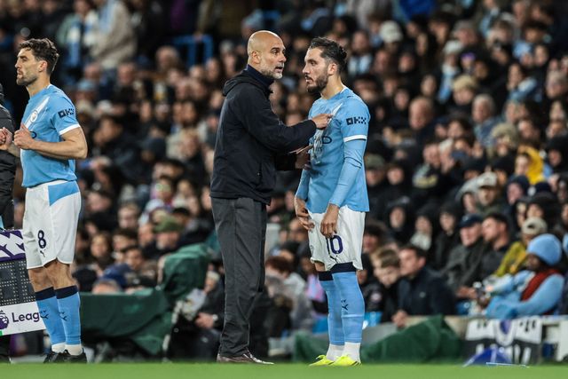 Josep Guardiola manager of Manchester City gives instructions to Rayan Cherki of Manchester City as he is substituted on during the Premier League match Manchester City vs Crystal Palace at Etihad Stadium, Manchester, United Kingdom on 13 May 2026

(Photo by Mark Cosgrove/News Images)