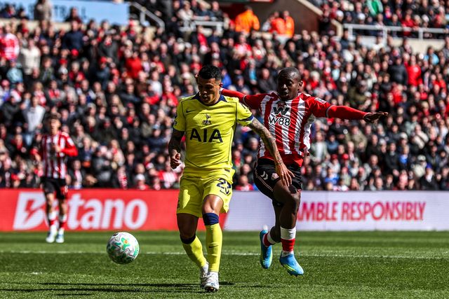 Noah Sadiki of Sunderland and Pedro Porro of Tottenham Hotspur battle for the ball during the Premier League match Sunderland vs Tottenham Hotspur at Stadium Of Light, Sunderland, United Kingdom on 12 April 2026

(Photo by Alfie Cosgrove/News Images)