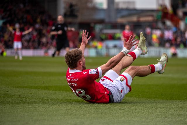 Wrexham's Sam Smith is brought down inside the box during the Sky Bet League 1 match Wrexham vs Stockport County at SToK Cae Ras, Wrexham, United Kingdom, 22nd March 2025

(Photo by Nik Mesney/News Images)