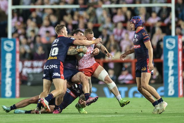 Josh Charley of Leigh Leopards is tackled during the Betfred Super League Round 26 match Leigh Leopards vs St Helens at Leigh Sports Village, Leigh, United Kingdom, 12th September 2025

(Photo by Mark Cosgrove/News Images)