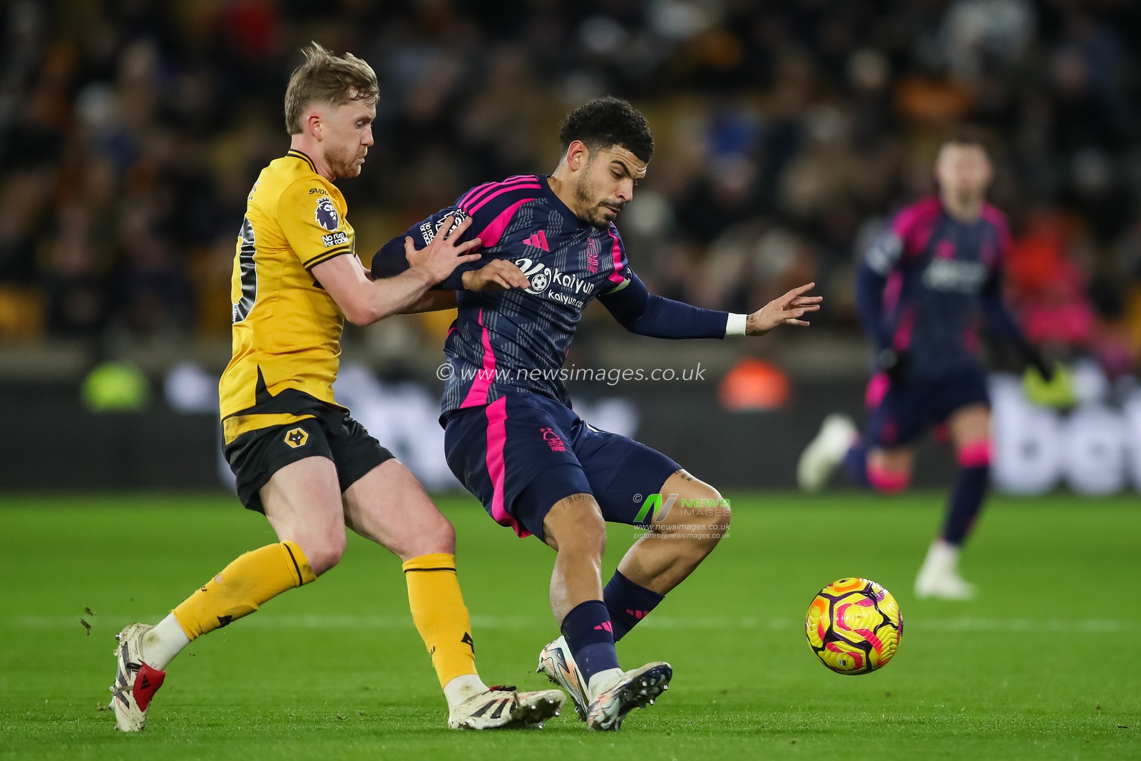 Morgan Gibbs-White of Nottingham Forest holds off Tommy Doyle of Wolverhampton Wanderers during the Premier League match Wolverhampton Wanderers vs Nottingham Forest at Molineux, Wolverhampton, United Kingdom, 6th January 2025

(Photo by Gareth Evans/News Images)