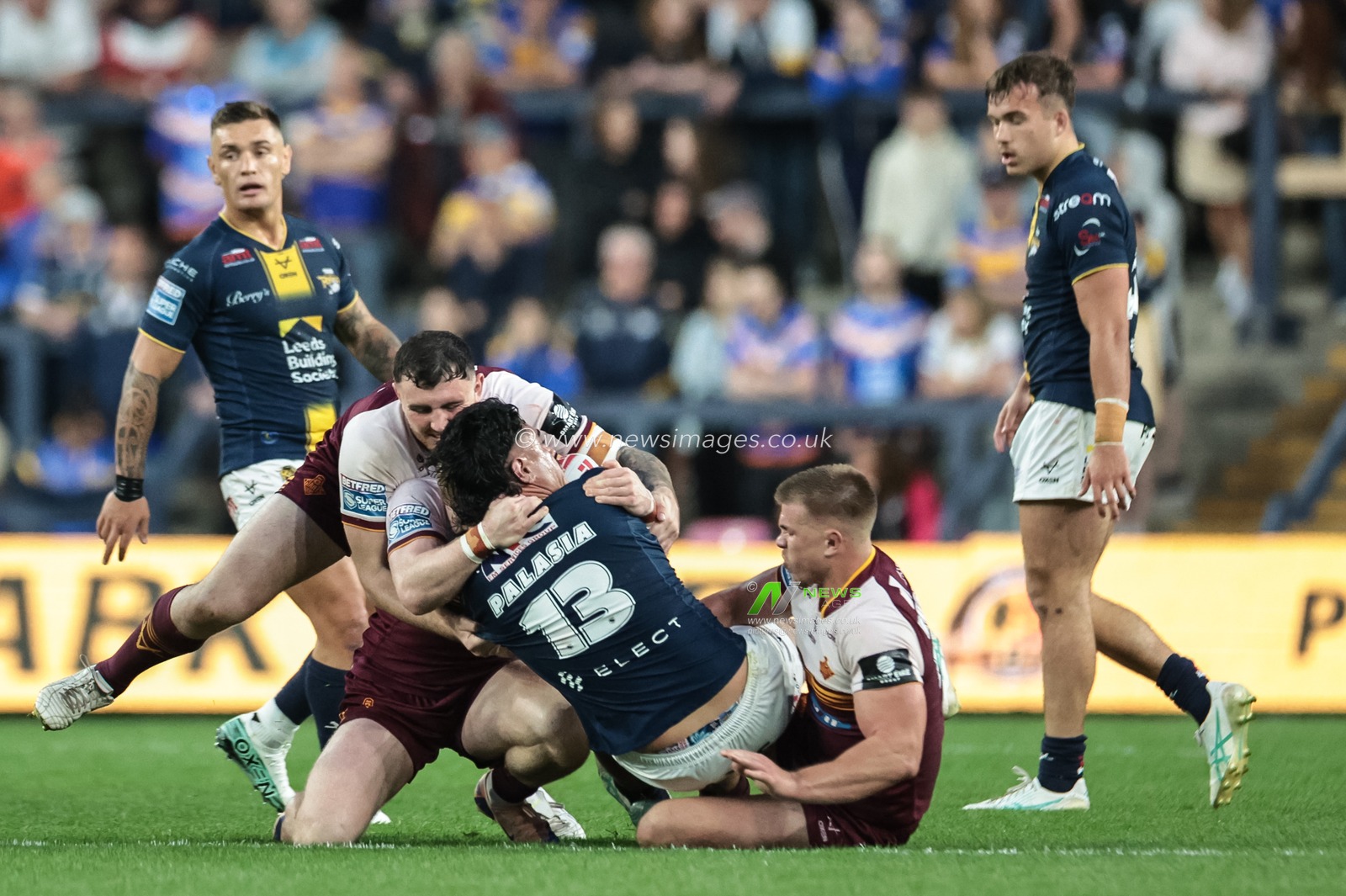 Keenan Palasia of Leeds Rhinos is tackled by Zac Woolford of Huddersfield Giants during the Betfred Super League round 12 match Leeds Rhinos vs Huddersfield Giants at AMT Headingley Stadium, Leeds, United Kingdom on 22 May 2026

(Photo by Mark Cosgrove/News Images)
