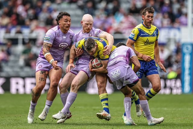 Lachlan Fitzgibbon of Warrington Wolves is tackled by Liam Farrell of Wigan Warriors during the Betfred Magic Weekend 2025 match Wigan Warriors vs Warrington Wolves at St. James's Park, Newcastle, United Kingdom, 4th May 2025

(Photo by Mark Cosgrove/News Images)