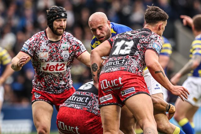 James Harrison of Warrington Wolves is tackled by Joe Ofahengaue of Leigh Leopards during the Betfred Super League round 7 match Warrington Wolves vs Leigh Leopards at The Halliwell Jones Stadium, Warrington, United Kingdom on 04 April 2026

(Photo by Alfie Cosgrove/News Images)