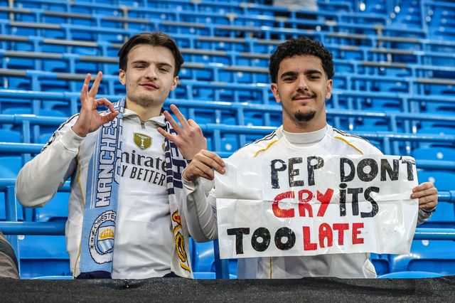 Real Madrid fans hold up a sign for Pep Guardiola manager of Manchester City during the UEFA Champions League last 16 second leg match Manchester City vs Real Madrid at The City of Manchester Stadium, Manchester, United Kingdom on 17 March 2026

(Photo by Mark Cosgrove/News Images)