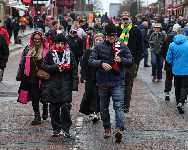 Manchester United fans make their way to Old Trafford during the Premier League match Manchester United vs Aston Villa at Old Trafford, Manchester, United Kingdom on 15 March 2026

(Photo by Mark Cosgrove/News Images)