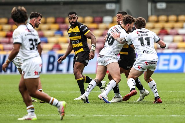 Paul Vaughan of York Knights is tackled by George Lawler of Castleford Tigers and Jordan Lane of Castleford Tigers during the Betfred Super League round 12 match York Knights vs Castleford Tigers at LNER Community Stadium, York, United Kingdom on 16 May 2026

(Photo by Alfie Cosgrove/News Images)