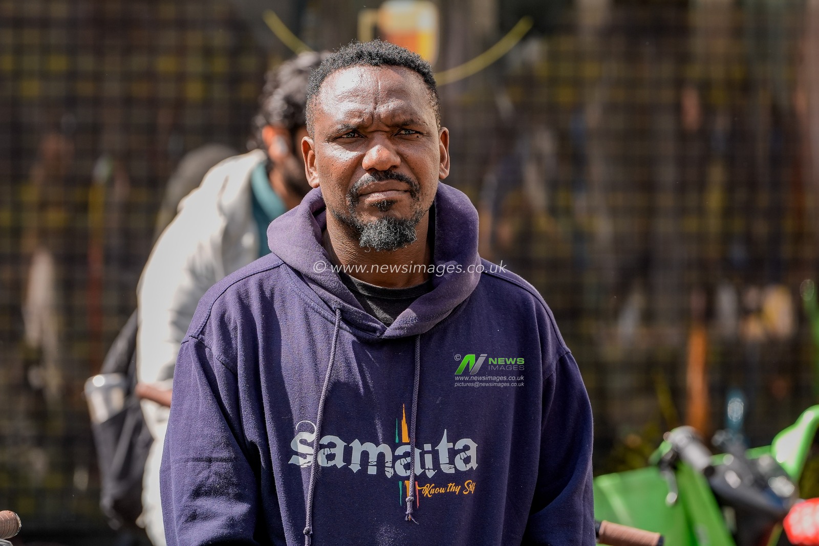 Blessed Mhlanga, a journalist imprisoned for 73 days and a guest at UN Watch recently looks on as Zimbabweans protest against the proposed constitution amendment at Embassy of Zimbabwe, London, United Kingdom on 18 April 2026

(Photo by Maynard Manyowa/News Images)