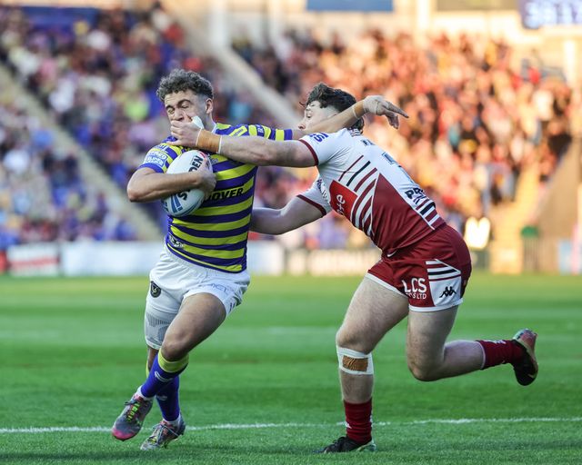 Cai Taylor-Wray of Warrington Wolves is tackled by Jai Field of Wigan Warriors during the Betfred Super League round 9 match Warrington Wolves vs Wigan Warriors at The Halliwell Jones Stadium, Warrington, United Kingdom on 24 April 2026

(Photo by Mark Cosgrove/News Images)