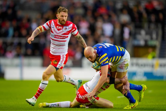 James Harrison of Warrington Wolves is tackled by Deon Cross of St Helens R.F.C. during the Betfred Super League round 14 match St Helens vs Warrington Wolves at The BrewDog Stadium, St Helens, United Kingdom on 11 June 2026

(Photo by Maynard Manyowa/News Images)