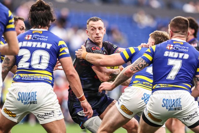 Frankie Halton of Leigh Leopards is tackled by Luke Thomas of Warrington Wolves during the Betfred Super League Magic Weekend match Leigh Leopards vs Warrington Wolves at Leigh Sports Village, Leigh, United Kingdom on 04 July 2026

(Photo by Alfie Cosgrove/News Images)
