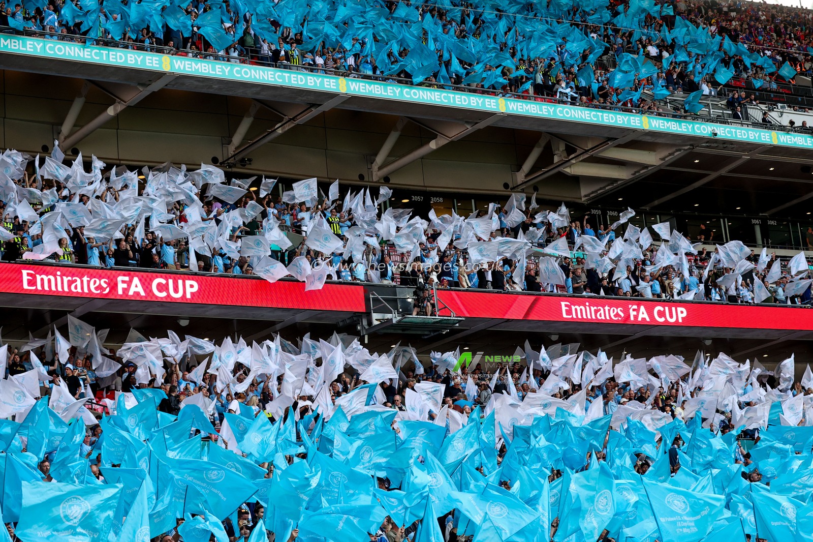 Manchester City fans wave flags prior to the Emirates FA Cup Final match Crystal Palace vs Manchester City at Wembley Stadium, London, United Kingdom, 17th May 2025

(Photo by Alfie Cosgrove/News Images)