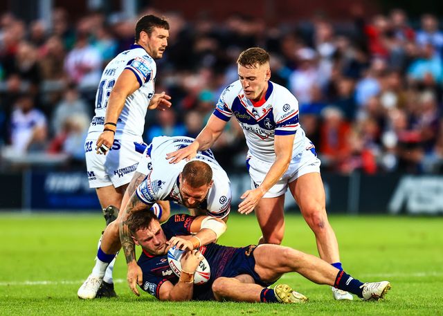 Matty Lees of St. Helens is tackled during the Betfred Super League round 21 match Wakefield Trinity vs St Helens at DIY Kitchens Stadium, Wakefield, United Kingdom, 8th August 2025

(Photo by Richard Bierton/News Images)