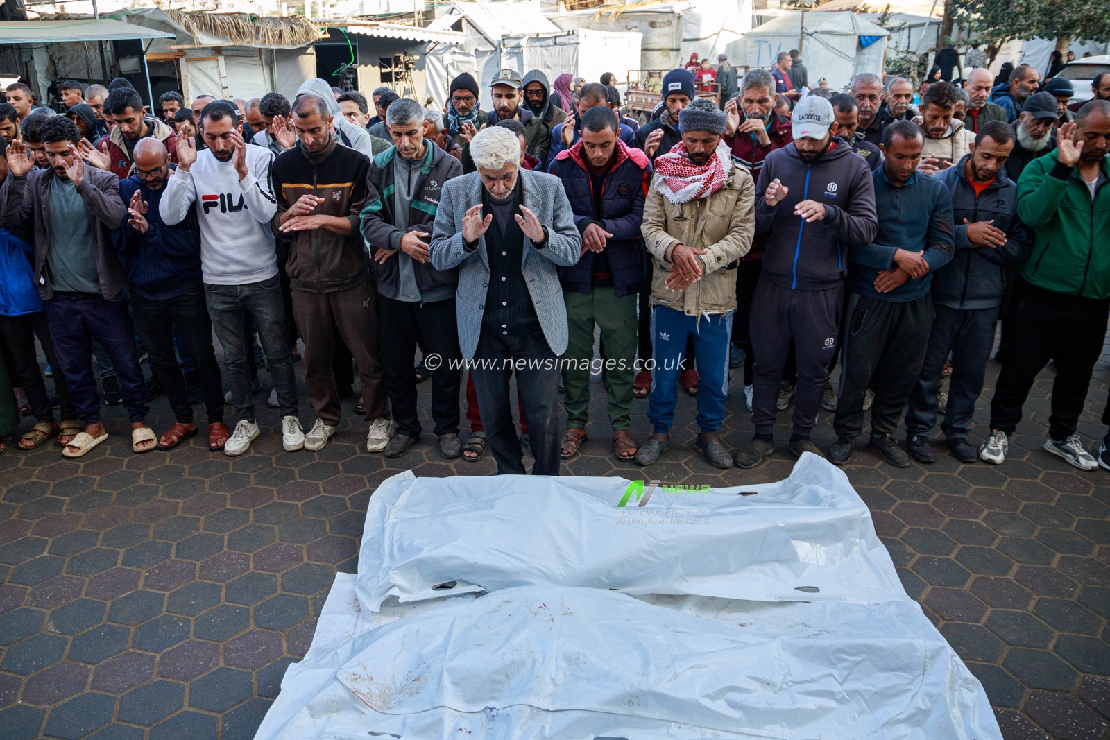 Palestinians bid farewell to the martyr who was killed when Israeli aircraft targeted one of the displaced people's tents last night, west of Deir al-Balah, in the central Gaza Strip.(Photo: Mohammed Skaik/News Images)