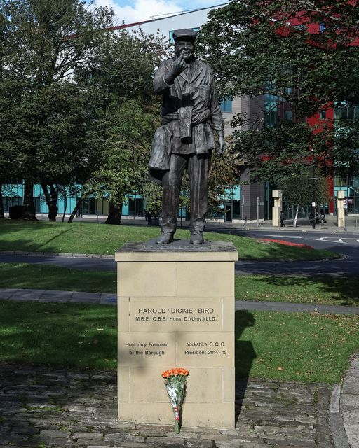 Flowers are laid at The Harold 'Dickie' Bird MBE, OBE statue after his passing today at the age of 92, Barnsley, United Kingdom, 23rd September 2025

(Photo by Mark Cosgrove/News Images)